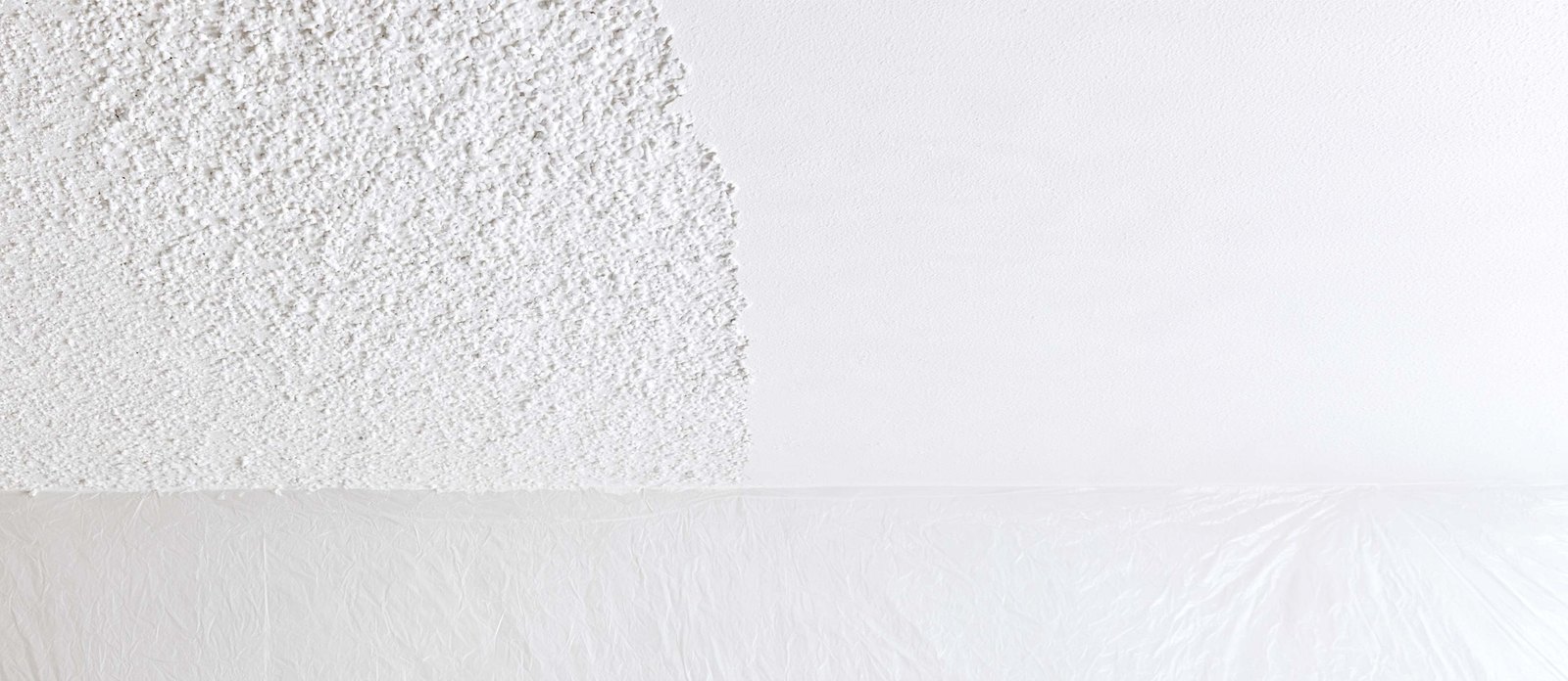 Close view of a ceiling with textured and smooth areas.